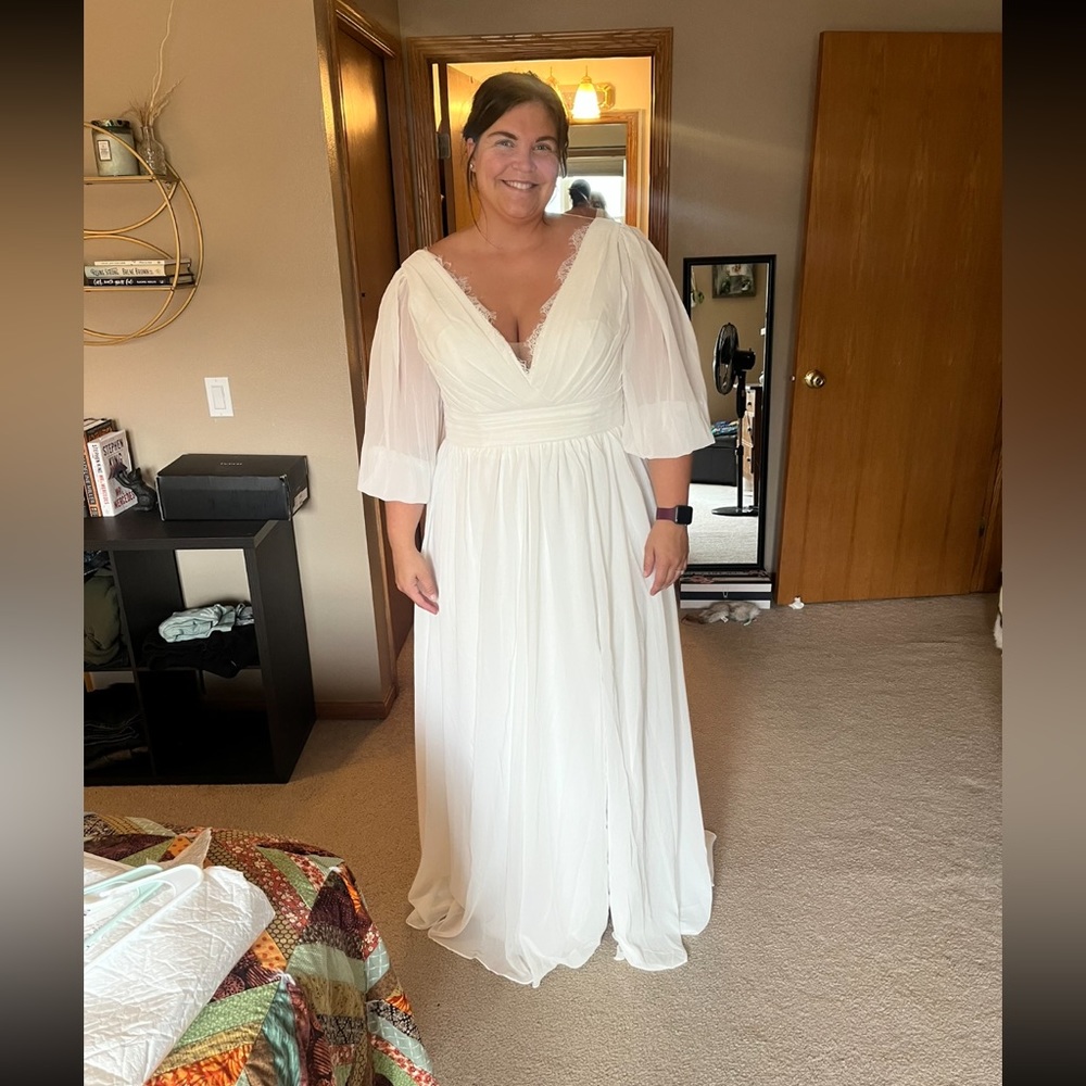 It’s a brand new white wedding gown!